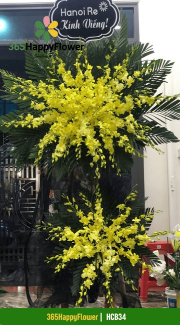 Kệ hoa chia buồn 2 tầng lan vũ nữ vàng dáng xòe HCB34
