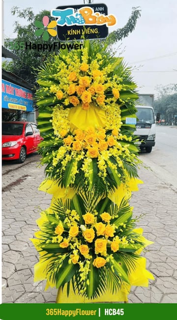 Kệ hoa viếng dáng oval hồng vàng và lan dendro vàng HCB45